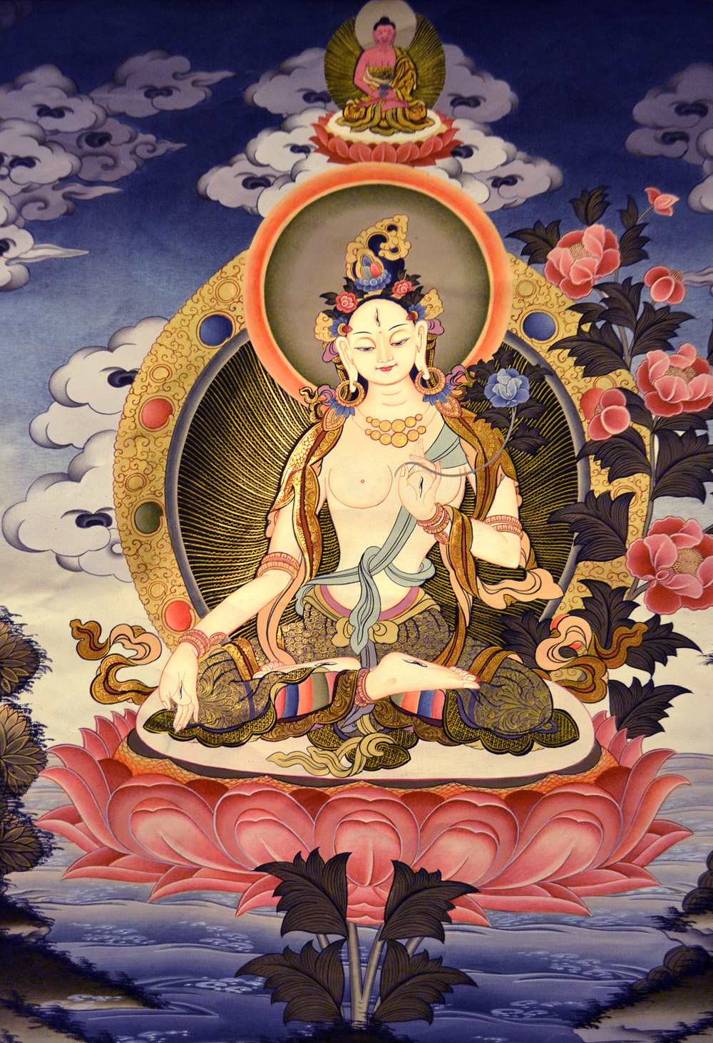 White Tara is the main female Bodhisattva, traditionally associated with the lotus. White Tara in Vegetka is displayed in the lotus position with seven eyes (the eyes, forehead, hands and feet), symbolizing the vision of all the earth, and the ability to help all feeling beings. Photo: Barbora Sajmovicova, 2016, Prague.